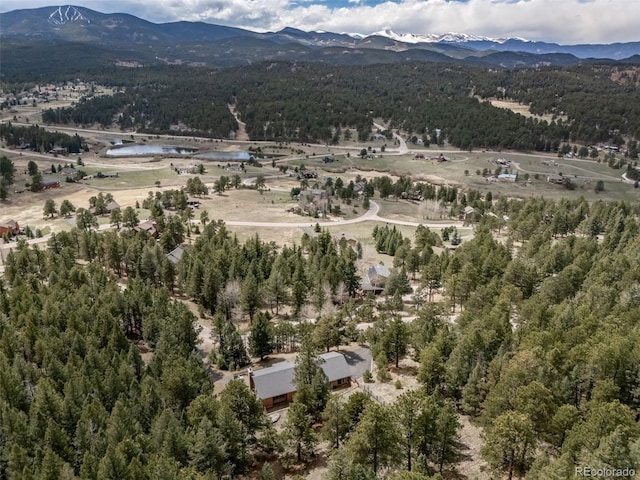 7815 Armadillo Trl, Evergreen, CO 80439 - aerial view with a wooded view and a mountain view