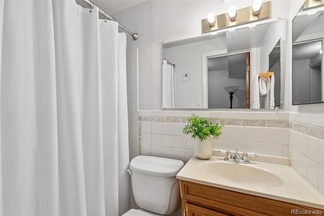 1244 Baron Rd, Colorado Springs, CO 80918 - full bathroom with vanity, a shower with curtain, and wainscoting