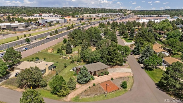 1244 Baron Rd, Colorado Springs, CO 80918 - aerial view of property and surrounding area with a tree filled landscape
