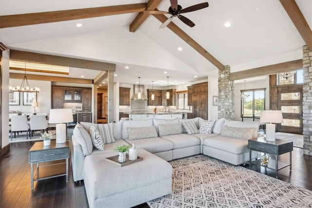 living room with ceiling fan with notable chandelier, high vaulted ceiling, dark hardwood / wood-style floors, and beam ceiling