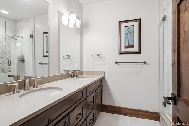 bathroom featuring vanity, tile patterned floors, and a shower with door