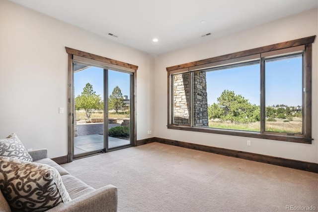 sitting room with light colored carpet