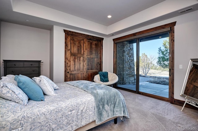 carpeted bedroom featuring access to outside