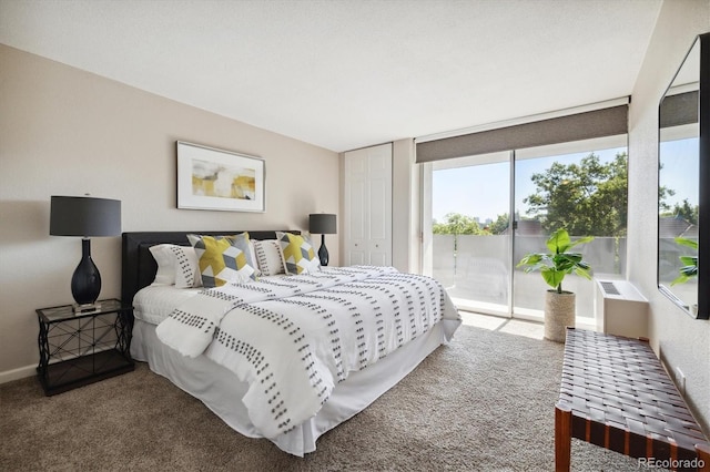 bedroom featuring access to exterior, baseboards, and carpet floors