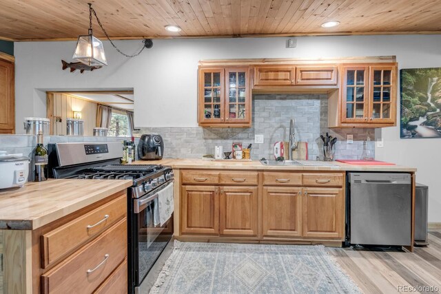 146 Dynamite Dr, Black Hawk, CO 80422 - kitchen featuring stainless steel appliances, a sink, light wood-type flooring, wood ceiling, and tasteful backsplash