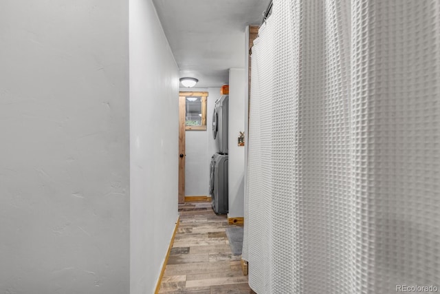146 Dynamite Dr, Black Hawk, CO 80422 - hall with stacked washer / drying machine and wood finished floors
