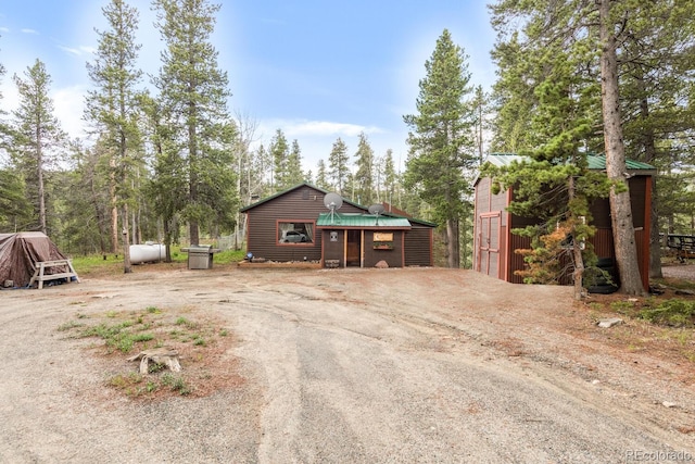 146 Dynamite Dr, Black Hawk, CO 80422 - view of front of house featuring an outdoor structure and metal roof