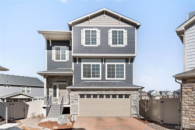 21925 E 44th Pl, Aurora, CO 80019 - view of front of home featuring a gate, driveway, a garage, and fence