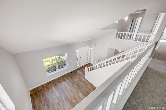 9147 W Rockland Pl, Littleton, CO 80128 - staircase with baseboards and wood finished floors