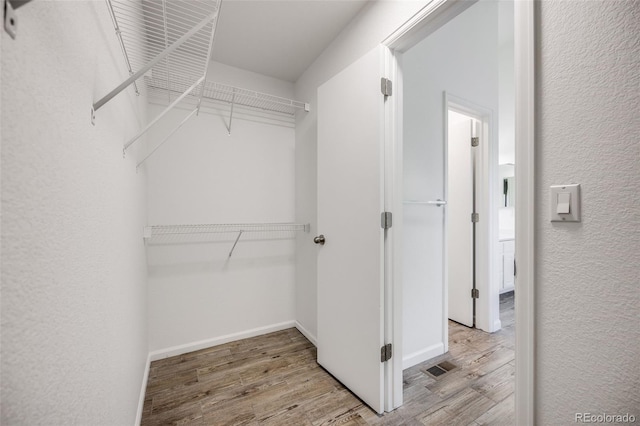 9147 W Rockland Pl, Littleton, CO 80128 - spacious closet featuring wood finished floors