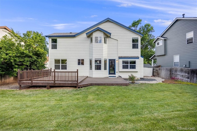 9147 W Rockland Pl, Littleton, CO 80128 - back of house featuring a fenced backyard and a deck