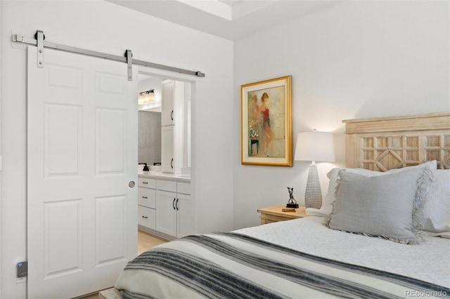 bedroom featuring a barn door