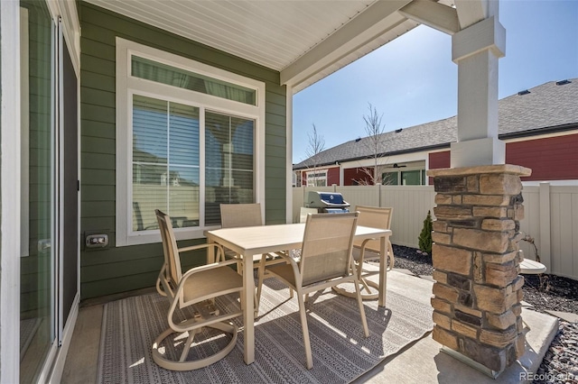 view of patio / terrace featuring outdoor dining area and fence