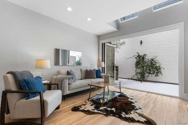 living room with light hardwood / wood-style flooring