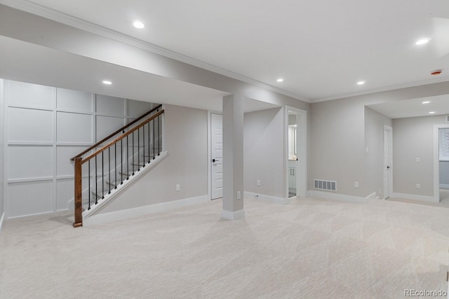 basement featuring crown molding and light carpet