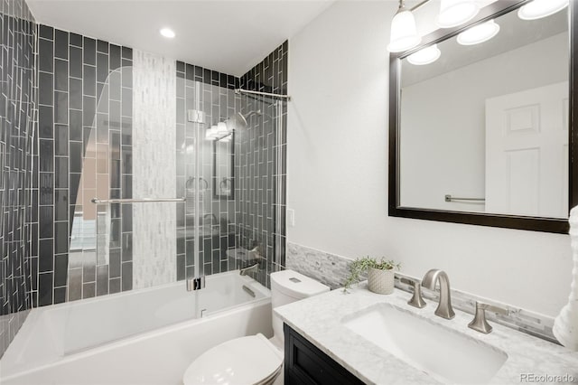 bathroom with shower / bath combination, vanity, and toilet