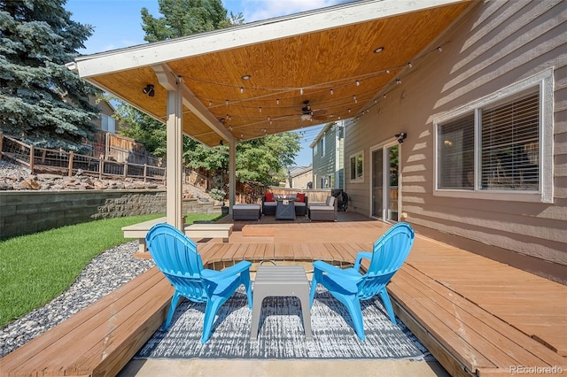 wooden deck featuring fence and an outdoor hangout area