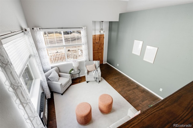 sitting room featuring baseboards and wood finished floors