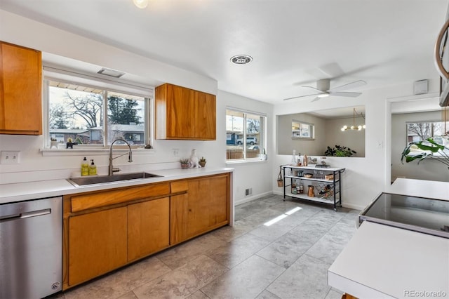 kitchen featuring a sink, visible vents, light countertops, stainless steel dishwasher, and brown cabinets