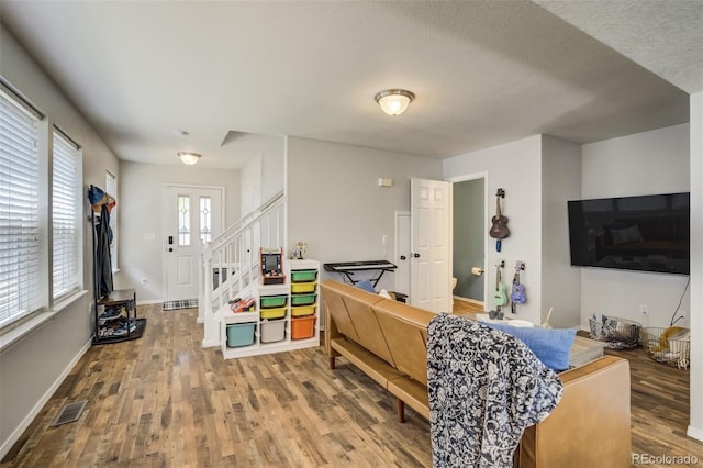 533 Horizon Pl, Dacono, CO 80514 - entryway featuring wood finished floors and stairway