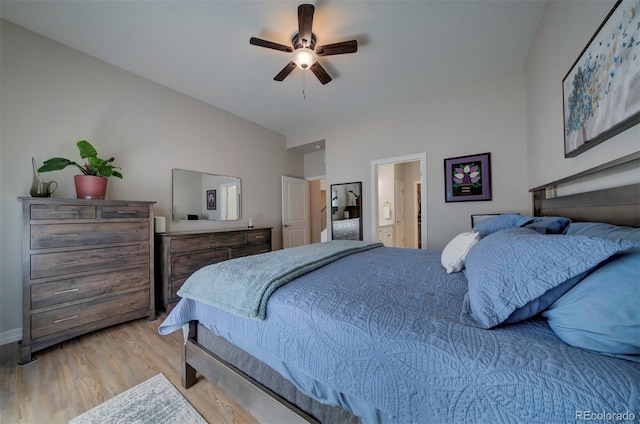 bedroom with wood finished floors, a ceiling fan, and vaulted ceiling