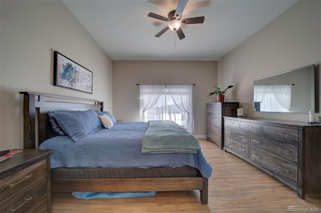 bedroom with a ceiling fan and light wood-style floors