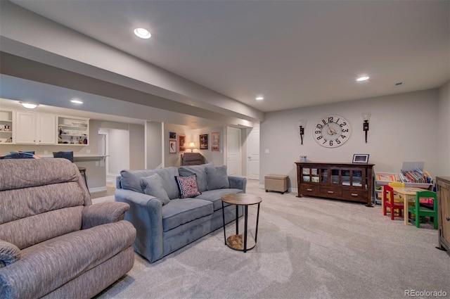 living room with light carpet, recessed lighting, and baseboards