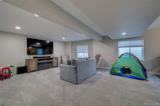 living area with carpet flooring, recessed lighting, and baseboards