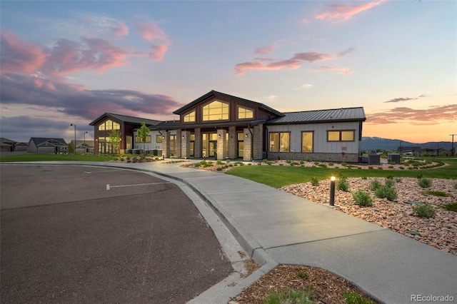 view of front of house with metal roof and a standing seam roof