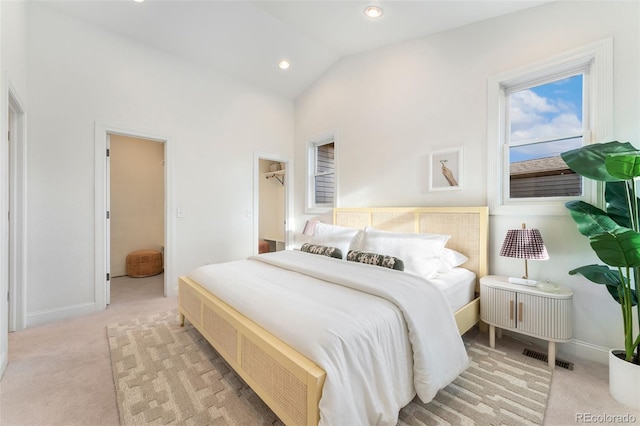 carpeted bedroom featuring baseboards, recessed lighting, a spacious closet, and lofted ceiling