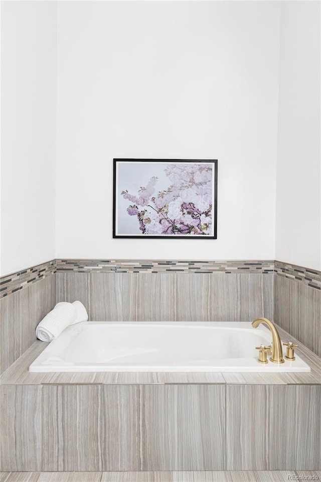 bathroom with a garden tub