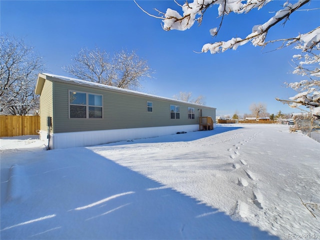 view of snow covered property