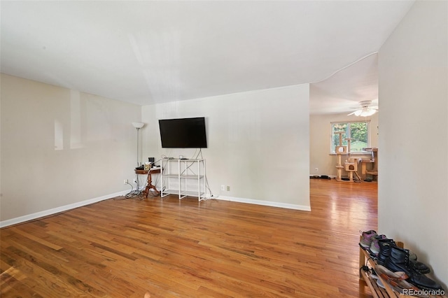 8250 Chase Way, Arvada, CO 80003 - unfurnished living room featuring light wood-type flooring and a ceiling fan