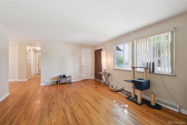 8250 Chase Way, Arvada, CO 80003 - workout room featuring wood finished floors and baseboards