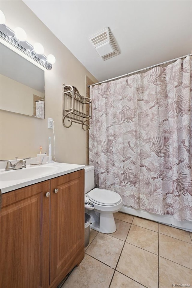 8250 Chase Way, Arvada, CO 80003 - bathroom featuring tile patterned floors and vanity