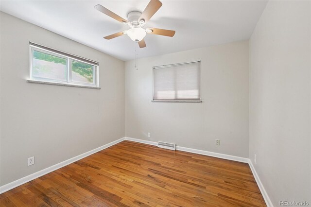 8250 Chase Way, Arvada, CO 80003 - unfurnished room with wood finished floors and ceiling fan