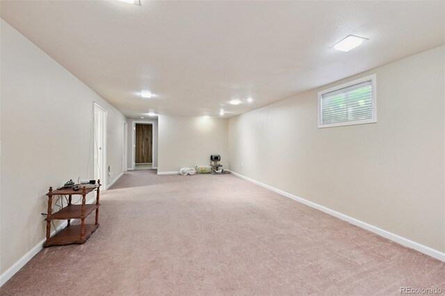 8250 Chase Way, Arvada, CO 80003 - below grade area with carpet flooring and baseboards