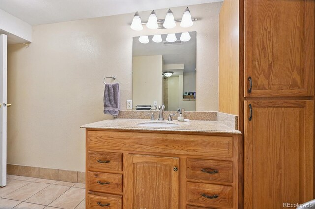 8250 Chase Way, Arvada, CO 80003 - bathroom with vanity and tile patterned flooring