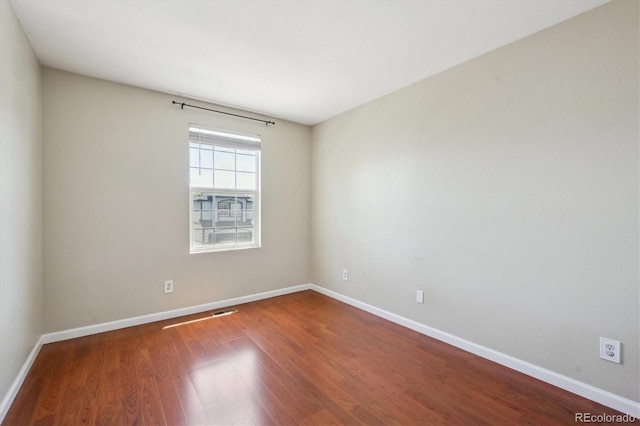 5193 E 119th Way, Thornton, CO 80233 - empty room with wood finished floors and baseboards