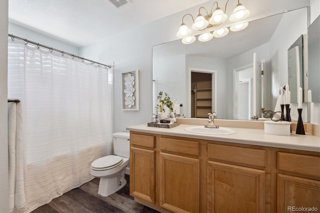 5193 E 119th Way, Thornton, CO 80233 - bathroom with toilet, vanity, and wood finished floors