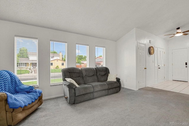 7784 Lewis St, Arvada, CO 80005 - living area with carpet floors, ceiling fan, vaulted ceiling, and a textured ceiling