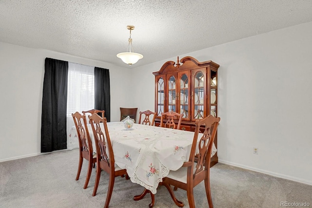 7784 Lewis St, Arvada, CO 80005 - carpeted dining area featuring baseboards and a textured ceiling