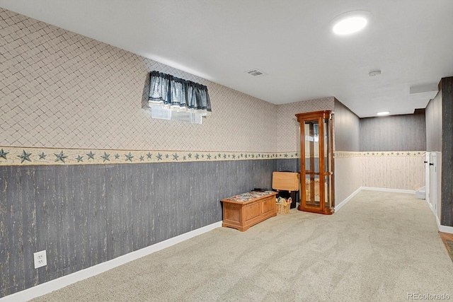 7784 Lewis St, Arvada, CO 80005 - finished below grade area with carpet flooring, wallpapered walls, and wainscoting