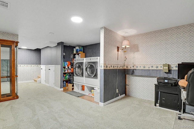 7784 Lewis St, Arvada, CO 80005 - laundry area featuring washing machine and clothes dryer, wallpapered walls, carpet, and a wainscoted wall