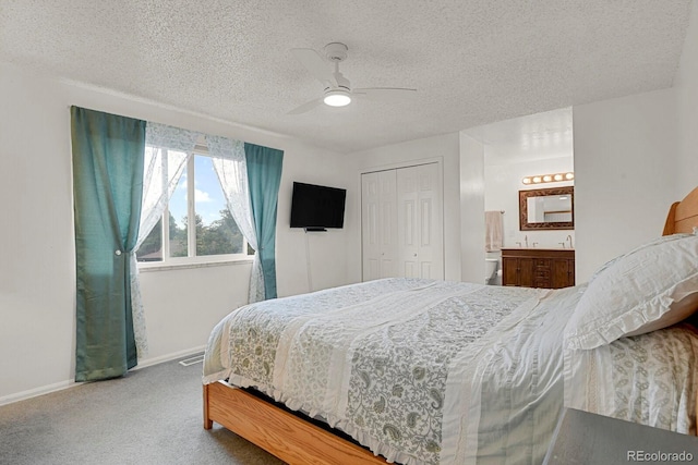 7784 Lewis St, Arvada, CO 80005 - bedroom with carpet flooring, a textured ceiling, a closet, ceiling fan, and ensuite bathroom