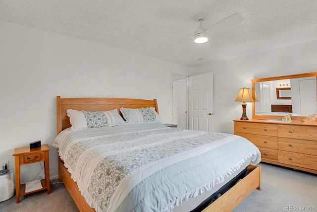 7784 Lewis St, Arvada, CO 80005 - bedroom featuring carpet floors, a textured ceiling, and a ceiling fan