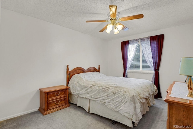 7784 Lewis St, Arvada, CO 80005 - bedroom featuring light colored carpet, a textured ceiling, and a ceiling fan