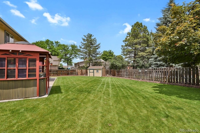 7784 Lewis St, Arvada, CO 80005 - fenced backyard with a storage shed