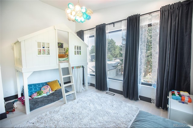 bedroom with a notable chandelier