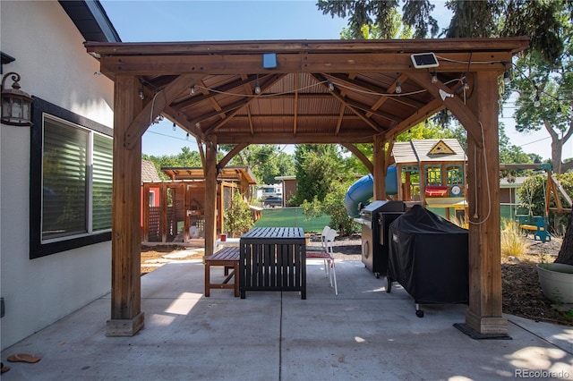 view of patio / terrace with a gazebo and a playground